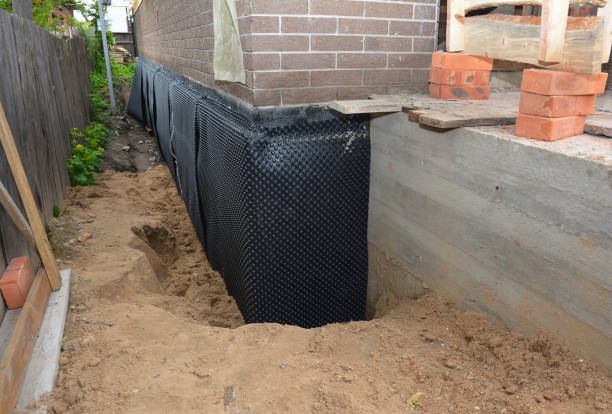 SJ Waterproofing Pros technician performing targeted Interior Drainage System assessment in Mulvane, KS